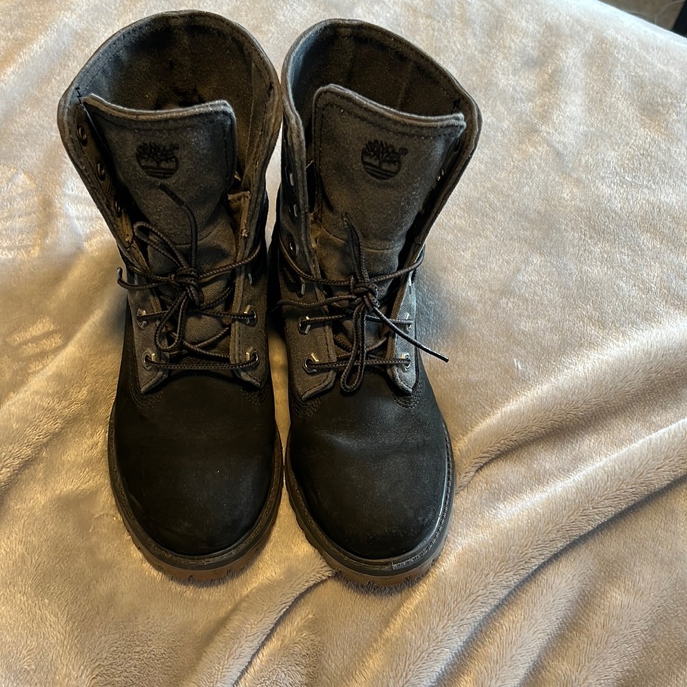 Black and grey lace up timberlands. Only worn once or twice.